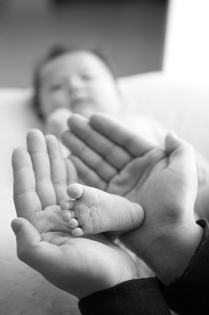 baby foot in the hands of an adult